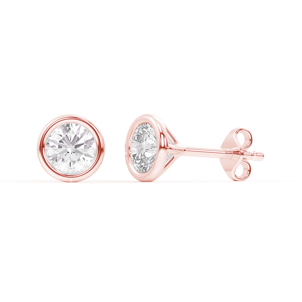 Lab-grown diamond bezel stud earrings in 14K rose gold, designed with a modern bezel setting to highlight the diamond’s brilliance.