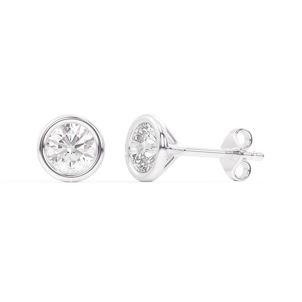 Lab-grown diamond bezel stud earrings in 14K white gold, showcasing round diamonds in a secure and elegant bezel setting.”